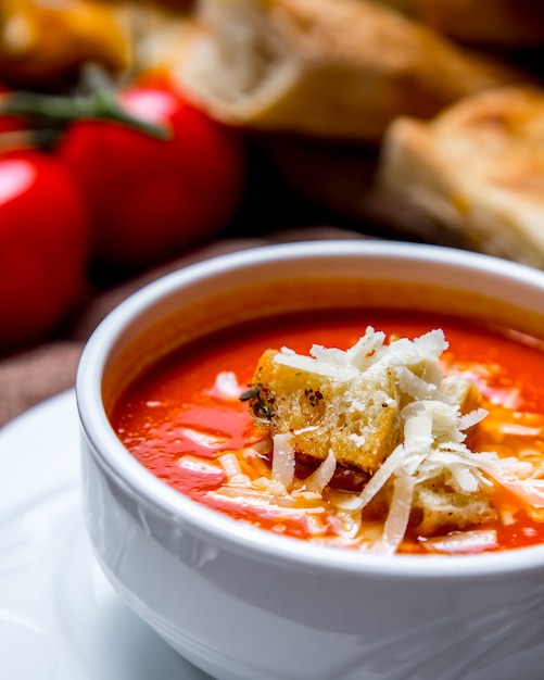 Free Photo | Portrait shooting tomato soup with crackers and cheese ...