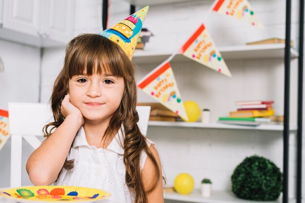 Free Photo | Portrait of smiling cute birthday girl wearing party hat