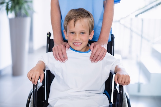 Premium Photo | Portrait of smiling disable boy in wheelchair