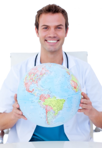 Premium Photo | Portrait of a smiling male doctor holding a terrestrial ...