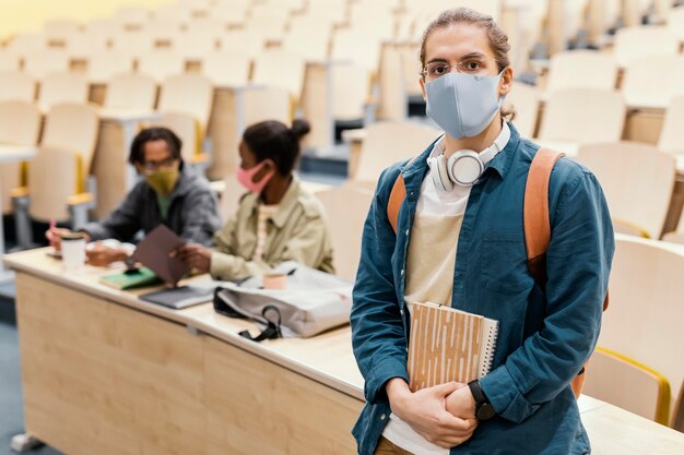 Portrait of student wearing medical mask Free Photo