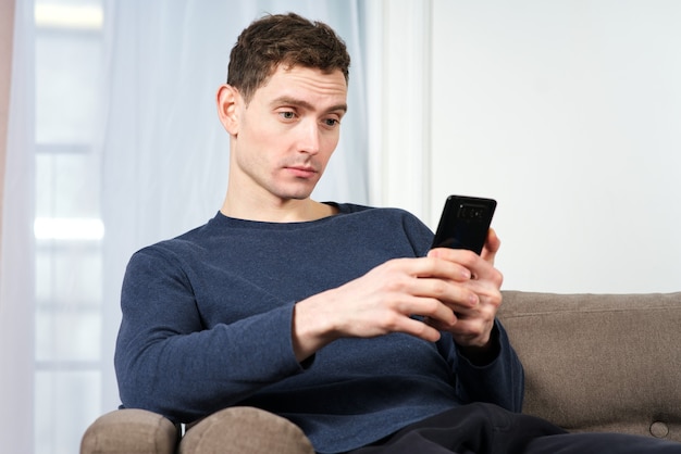 Premium Photo Portrait Of Surprised Amazed And Tired Guy Young Man Is