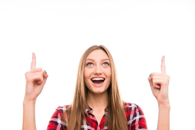 Premium Photo | Portrait of surprised girl showing pointer fingers up