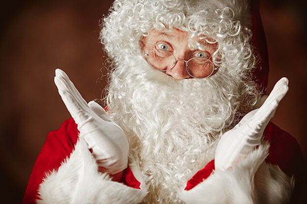 Free Photo | Portrait of surprised santa claus in red costume