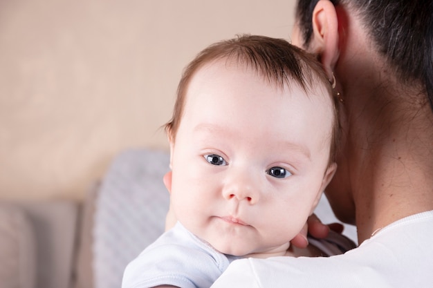 premium-photo-portrait-of-a-three-month-old-baby-boy-over-mom-s