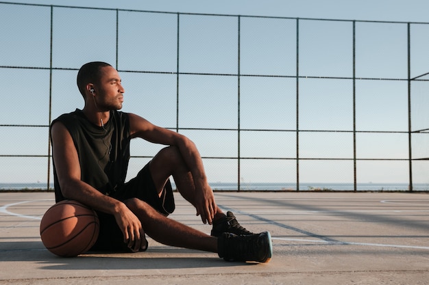 premium-photo-portrait-of-a-tired-basketball-player-resting-after