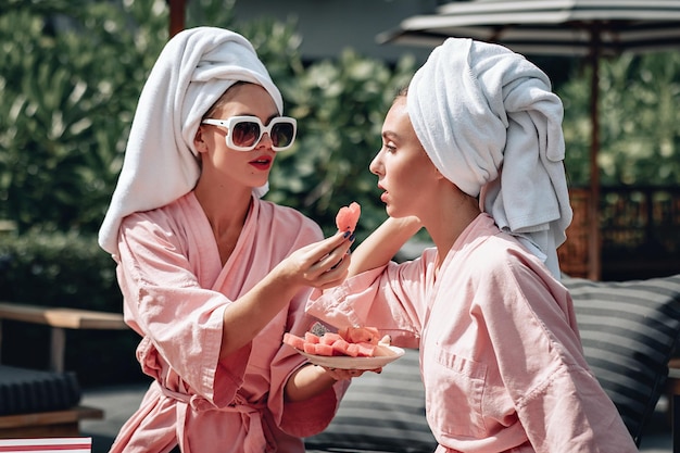 Premium Photo Portrait Of Two Sexual Adorable Women Wearing Identical