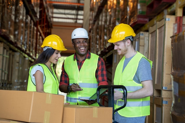 Premium Photo | Portrait of warehouse team discuss about work in a ...