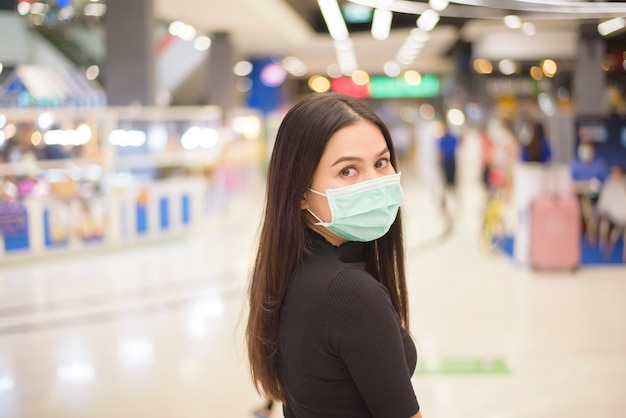 Premium Photo Portrait Of Woman Is Wearing Surgical Mask In Shopping Center
