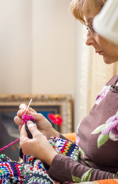 Portrait Of Woman Knitting A Vintage Wool Quilt Stock Photo   Image Of