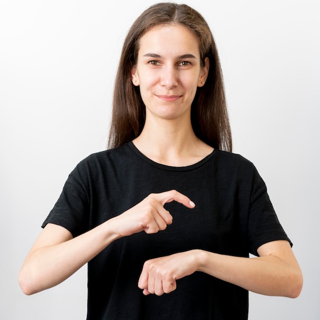 Free Photo | Portrait of woman teaching sign language