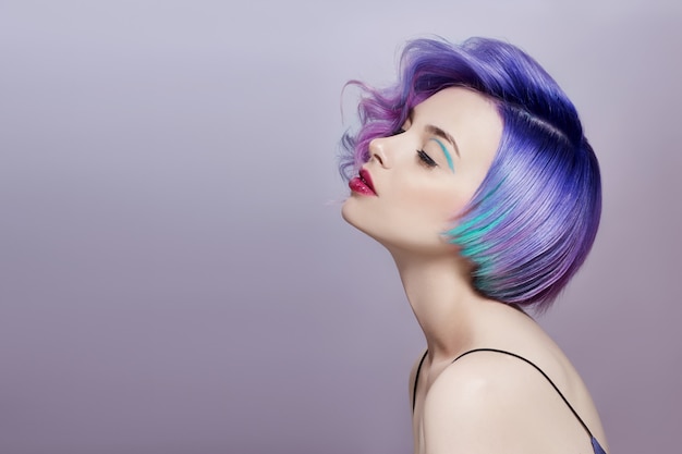 Portrait of woman with bright colored flying hair Premium Photo