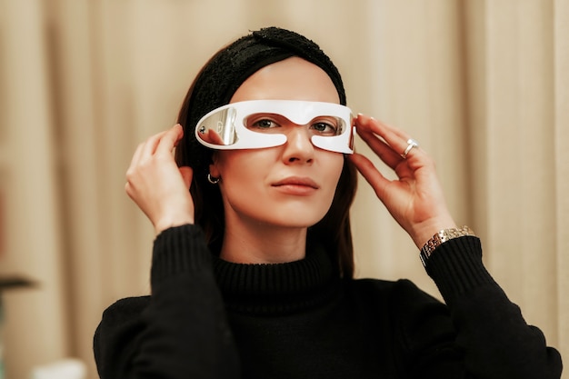 Premium Photo Portrait Of A Woman With Led Glasses Facial Skin Care