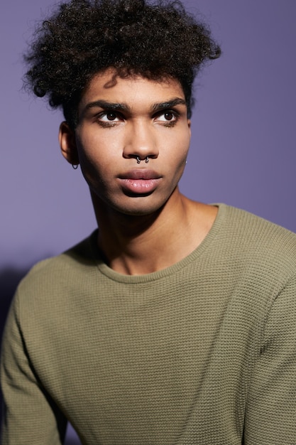 Premium Photo | Portrait of young afroamerican transgender man with ...