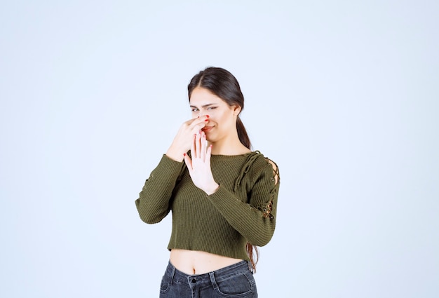 Free Photo | Portrait of a young beautiful woman model holding her nose ...