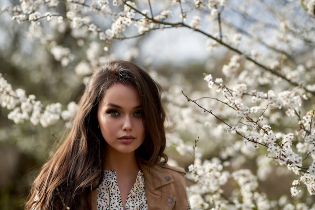 Premium Photo Portrait Of Young Beautiful Woman In Spring Blossom Trees Spring Flowering Trees