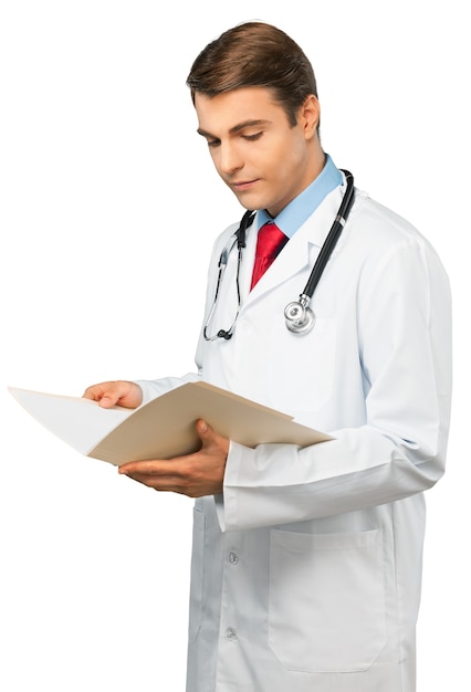 Premium Photo | Portrait of a young doctor reading medical record