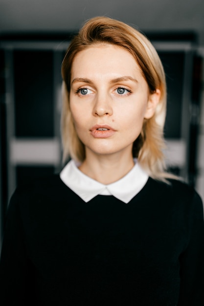 Premium Photo Portrait Of Young Elegant Short Haired Blond Girl In Formal Black Clothes Posing