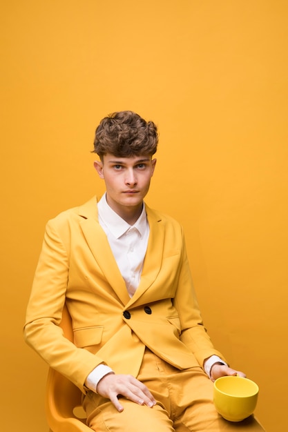 Free Photo | Portrait of young handsome man in a yellow scene