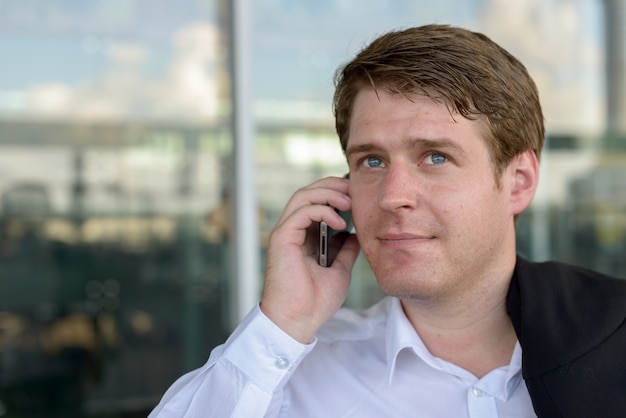 Premium Photo | Portrait of young handsome scandinavian businessman at ...