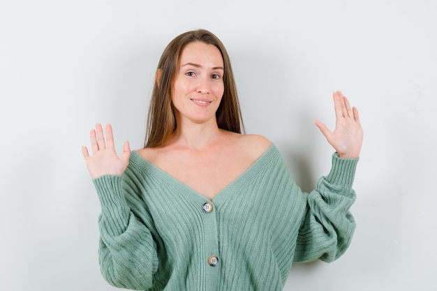 Free Photo | Portrait of young lady showing palms in surrender gesture ...