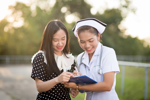 Premium Photo | Portrait of a young nurse wearing a white hat