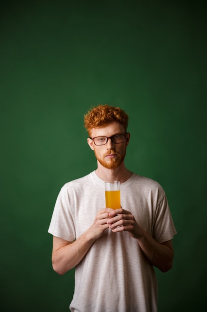 Free Photo Portrait Of A Young Redhead Man Holding Glass Of Beer