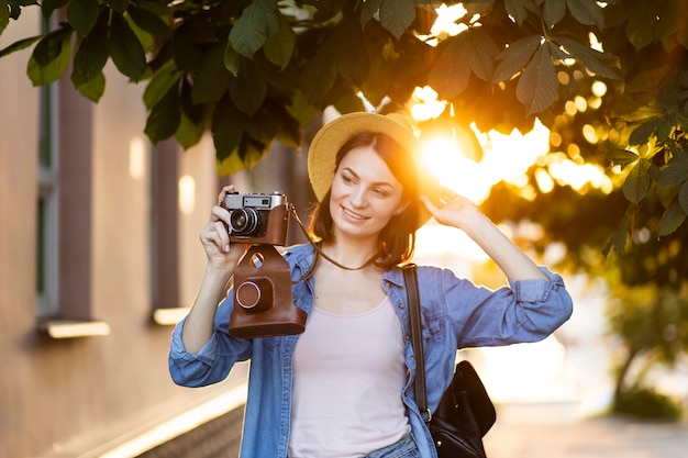 Free Photo | Portrait of young woman taking pictures on holiday