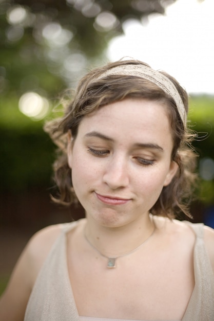 premium-photo-portrait-of-young-woman-with-demure-expression-looking