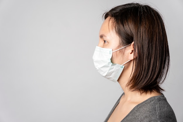 Free Photo | Portrait of young woman with surgical mask