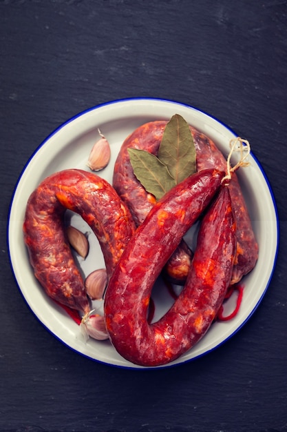 Premium Photo | Portuguese smoked sausages chourico on white dish