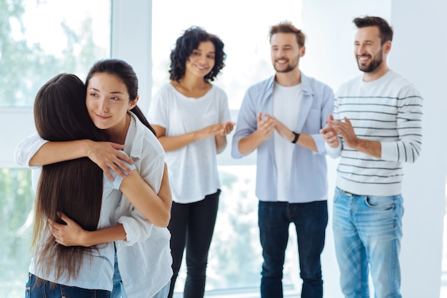 Premium Photo | Positive nice delighted women standing together and ...