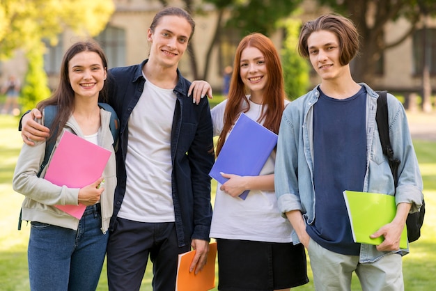 Free Photo | Positive teenagers posing together at university