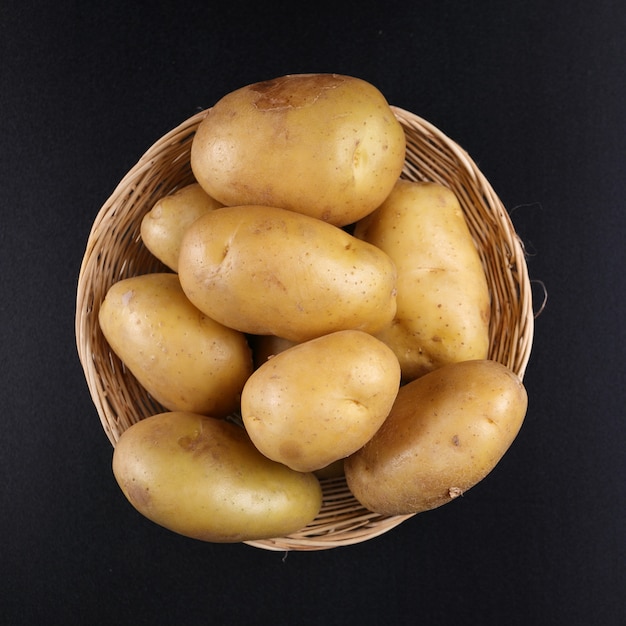 Premium Photo Potatoes on basket