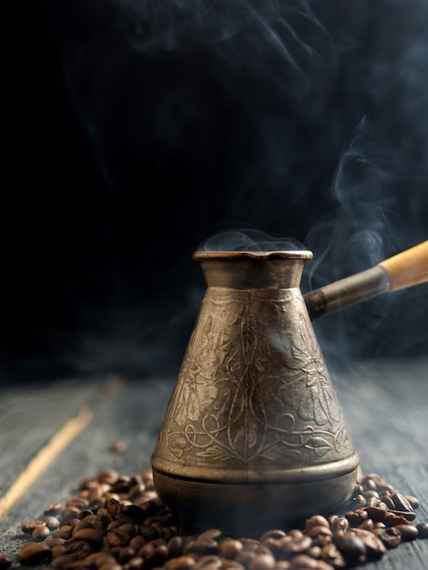 Premium Photo | Pots with freshly brewed coffee on a dark background