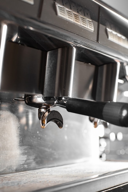 Premium Photo | Pouring coffee stream from professional machine in cup ...