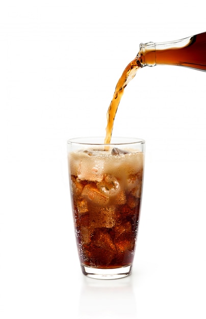 Premium Photo | Pouring cola from bottle into glass with foam isolated ...