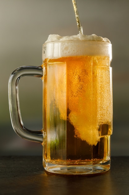 Premium Photo Pouring Fresh Beer Into A Glass