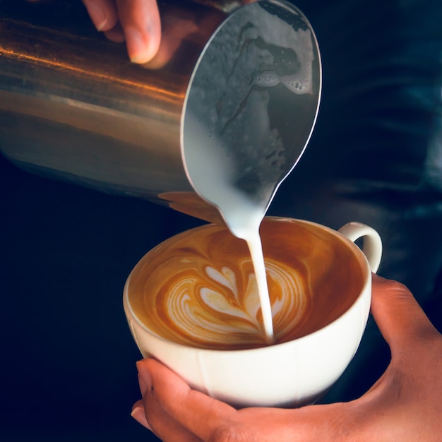 Premium Photo | Pouring latte