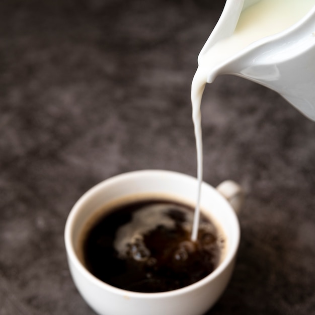 Pouring Milk Into Coffee Cup Photo Free Download