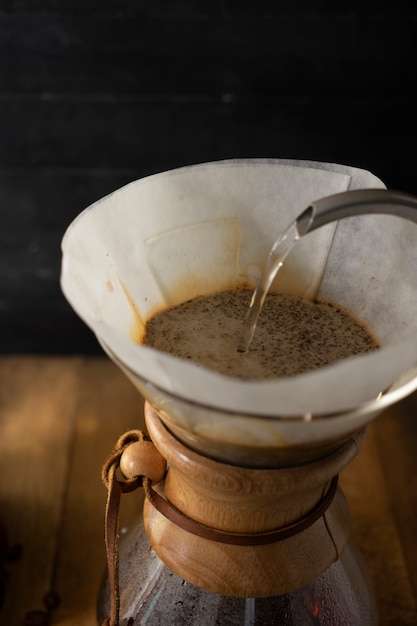 premium-photo-pouring-water-to-prepare-a-cup-of-coffee