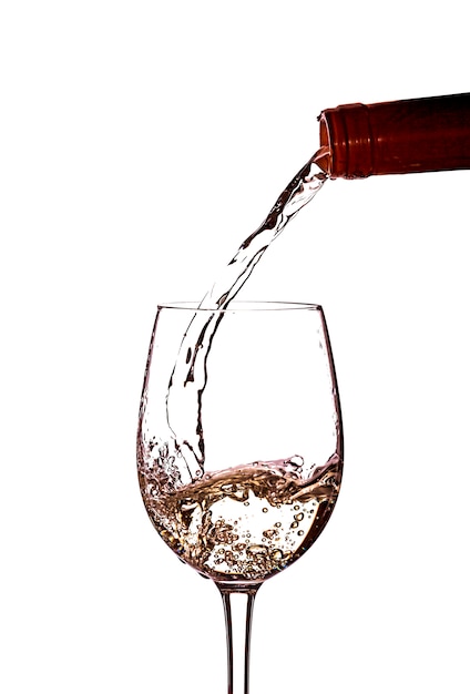 グラスに白ワインを注ぐ プレミアム写真
