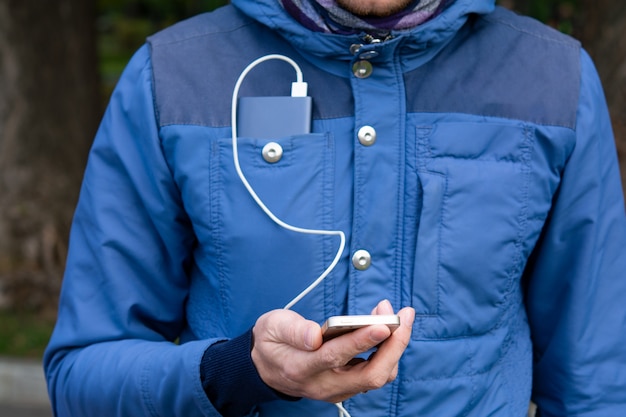 Premium Photo | Power bank in the hands of a man