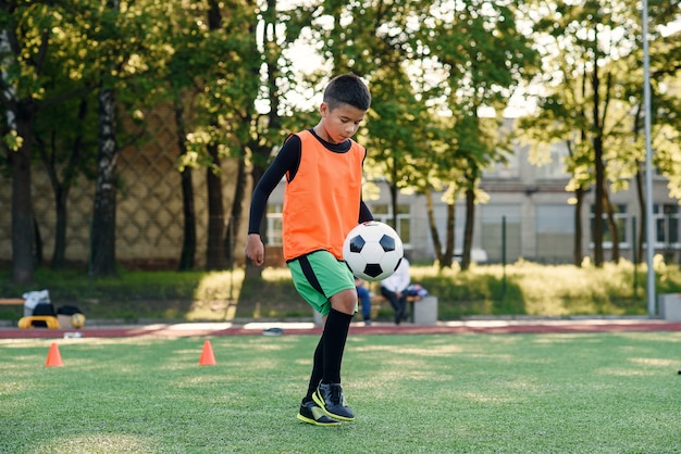 Premium Photo | Practicing sport exercises at artificial stadium.