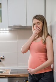 Pregnant Woman With Vomiting Upset Pregnant Woman With Hand On 