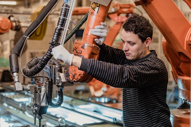 Premium Photo | Preparing a robot for the production of a new type of ...