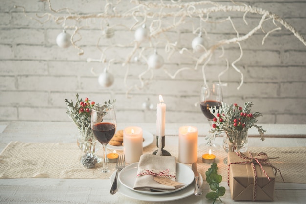 Present Plates Cutlery Candles And Decorations Arranged On