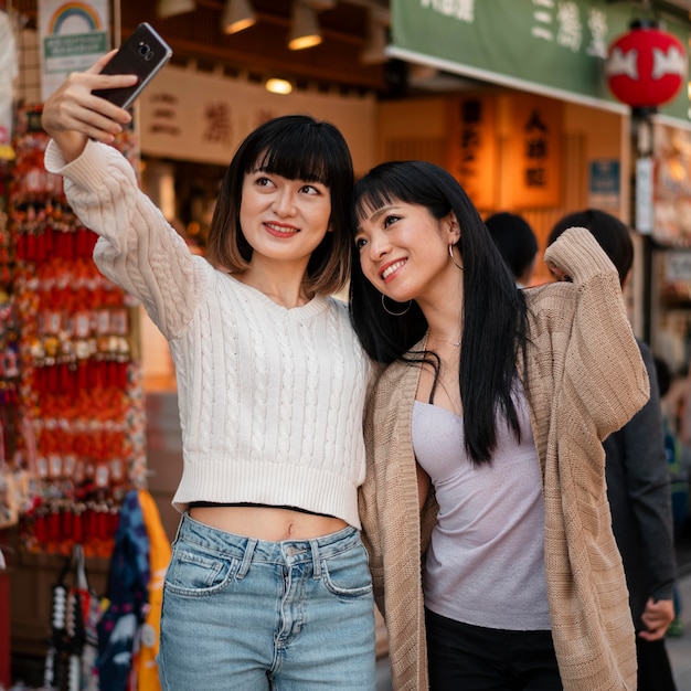 Free Photo | Pretty asian girls taking a selfie