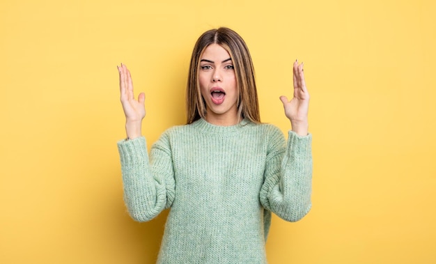 Premium Photo | Pretty caucasian woman looking shocked and astonished ...