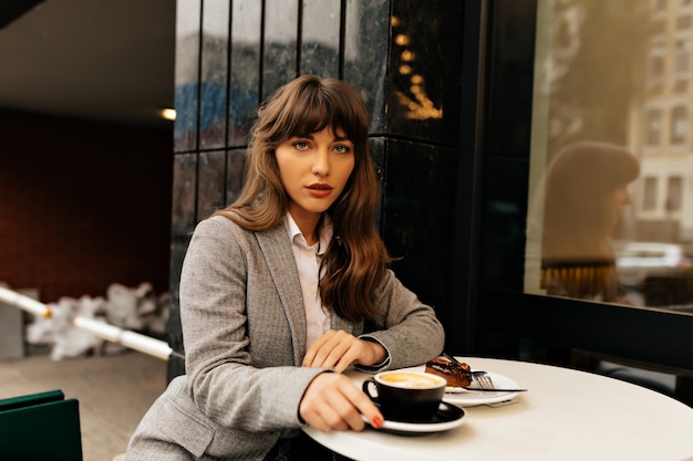 Free Photo | Pretty charming lady in grey jacket with long wavy hair ...